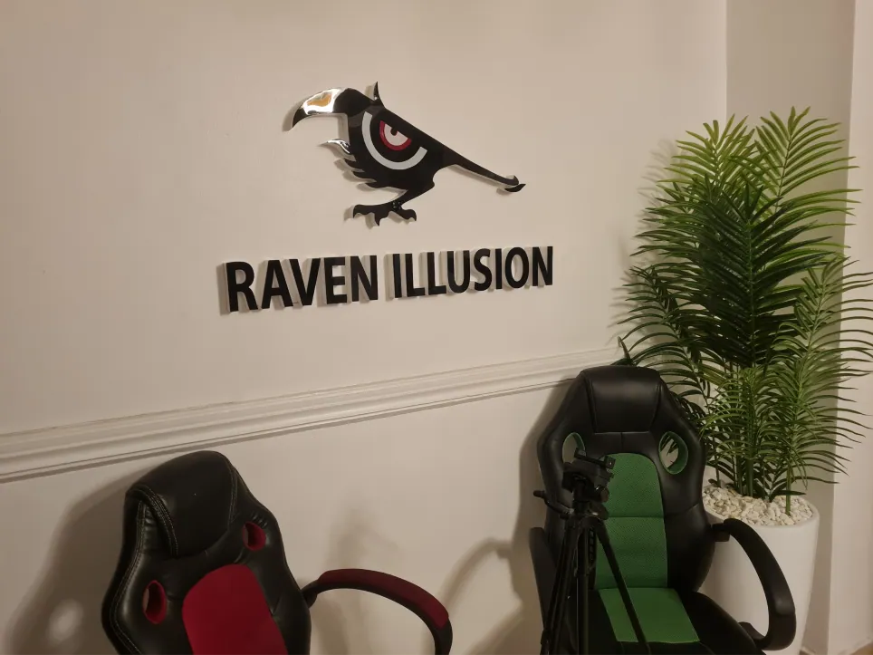 The Raven Illusion logo on the wall of our studio
